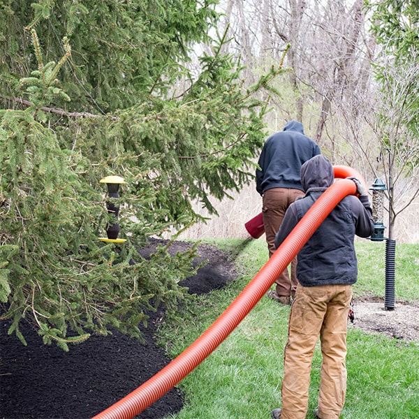 mulch blowing involves the use of specialized equipment to efficiently disperse mulch over a designated area